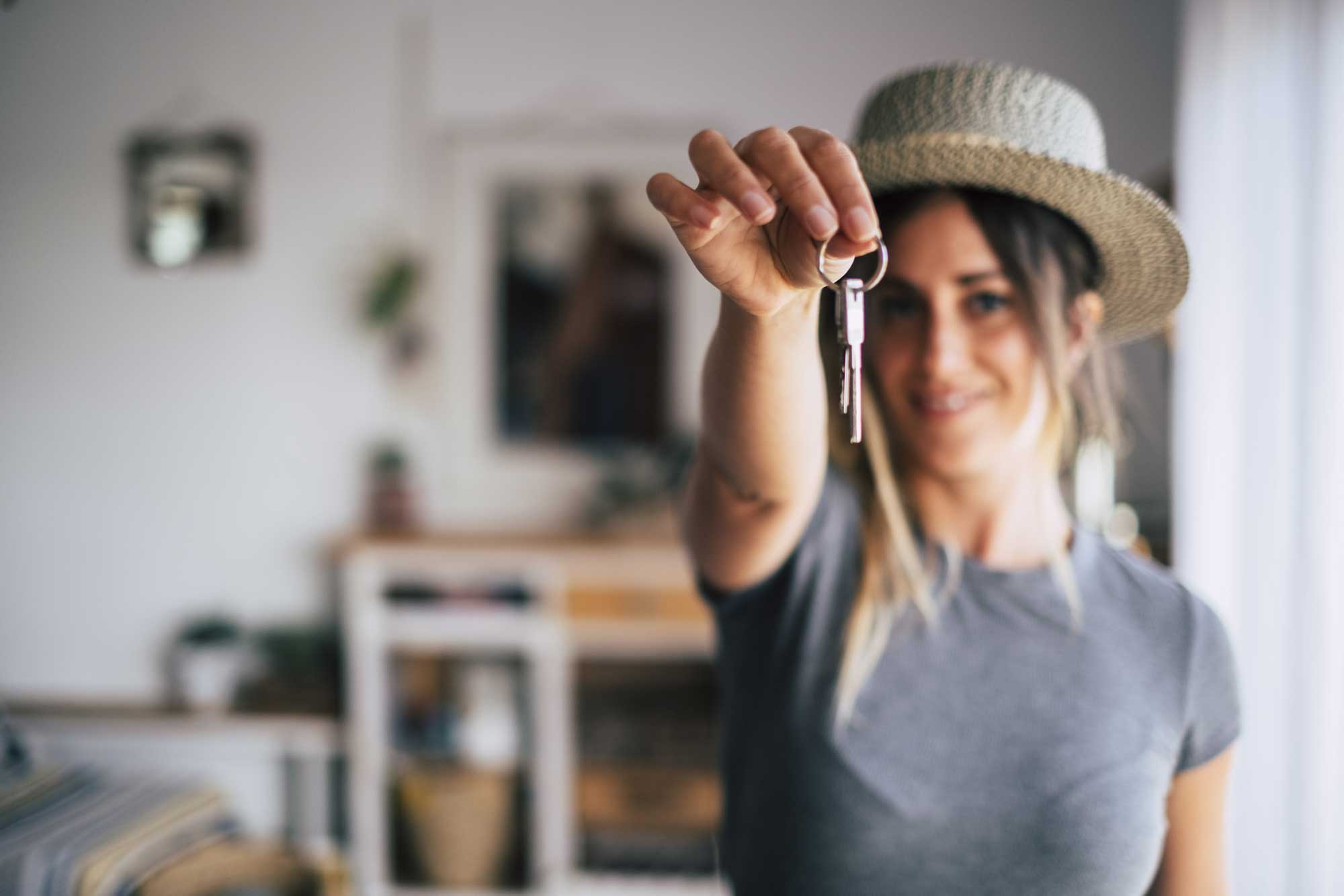 woman with keys to her new home